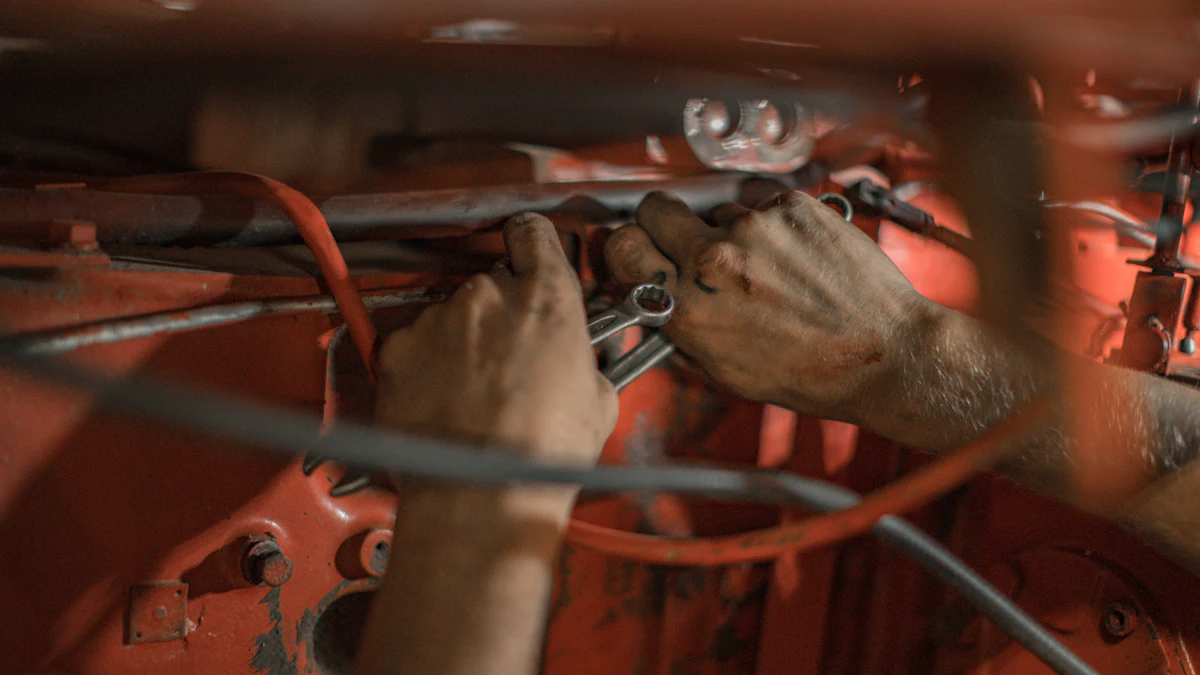Owner-operator working hands-on in a small garage engine bay