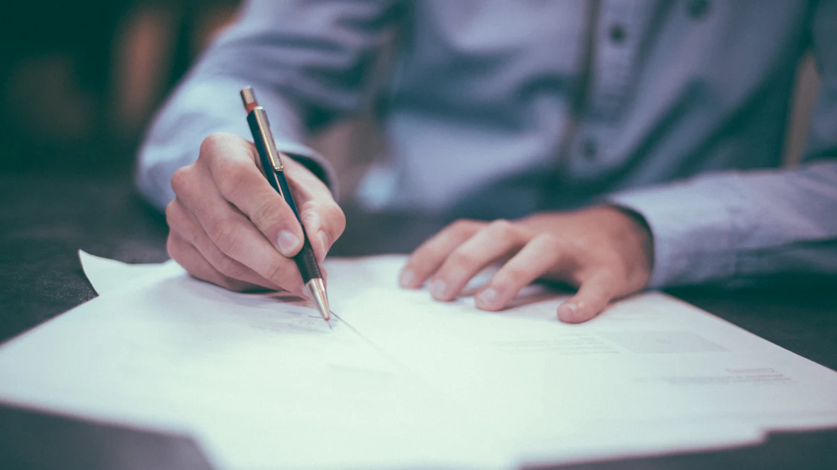 Garage owner signing paperwork before switching software providers